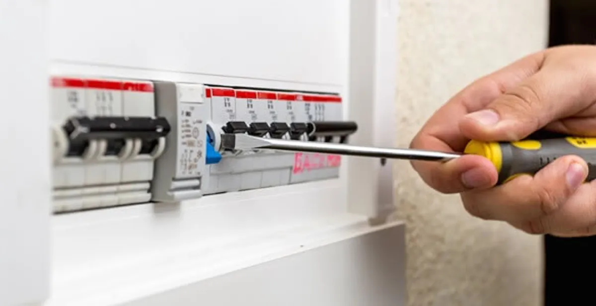 electrical panel upgrade service showing technician adjusting circuit breakers during system upgrade in West Palm Beach, FL