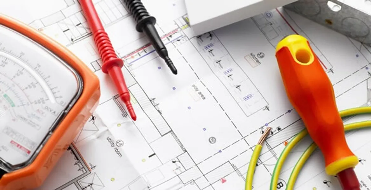 licensed electrician planning and testing electrical systems using professional tools in West Palm Beach, FL