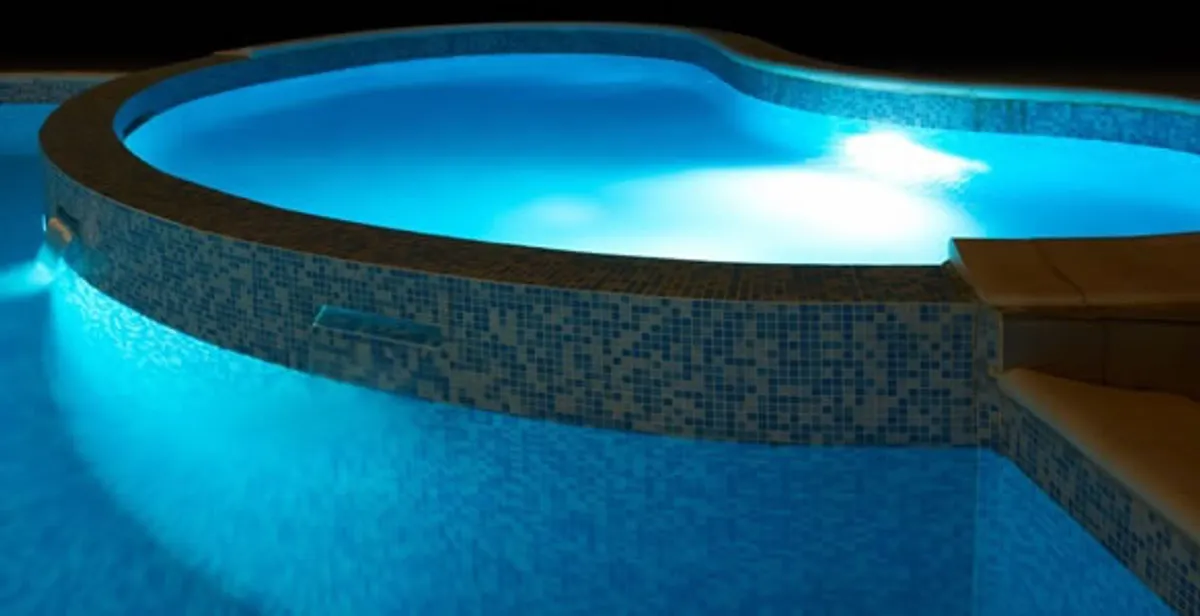 pool light installation and repair services highlighting illuminated pool interior lighting in West Palm Beach, FL