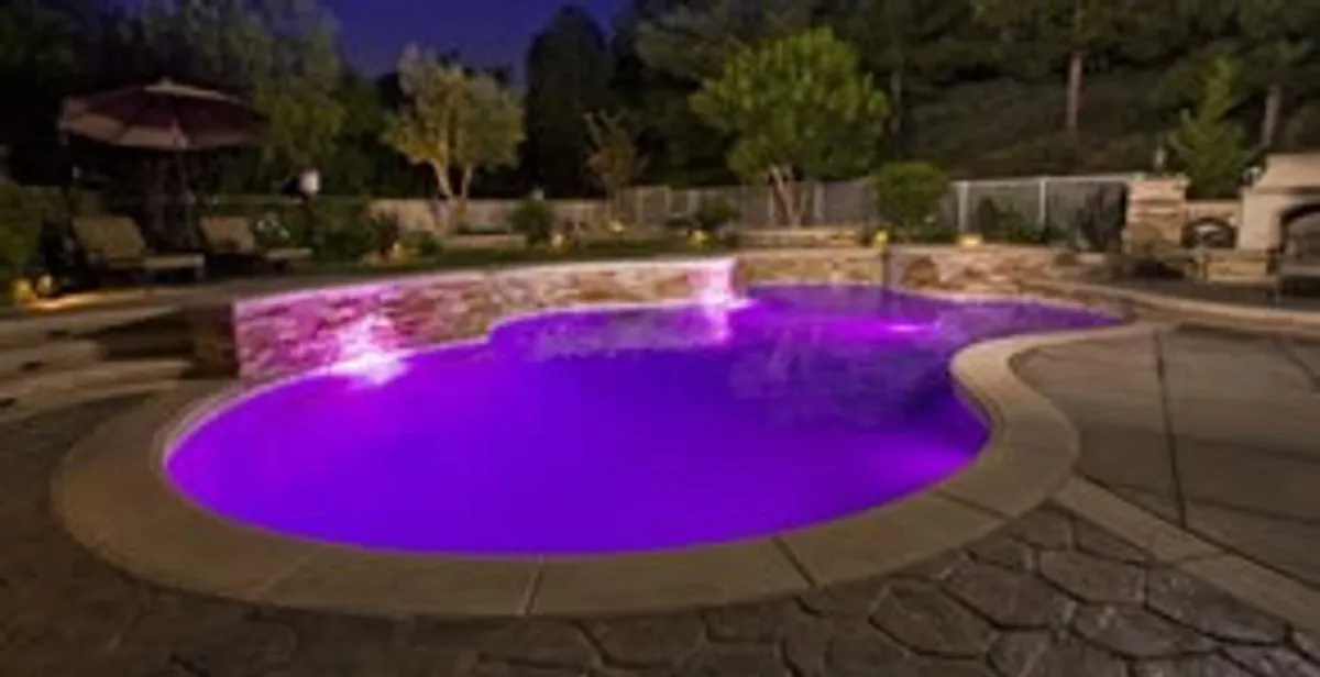 pool light installation and repair services illuminating a residential swimming pool in West Palm Beach, FL