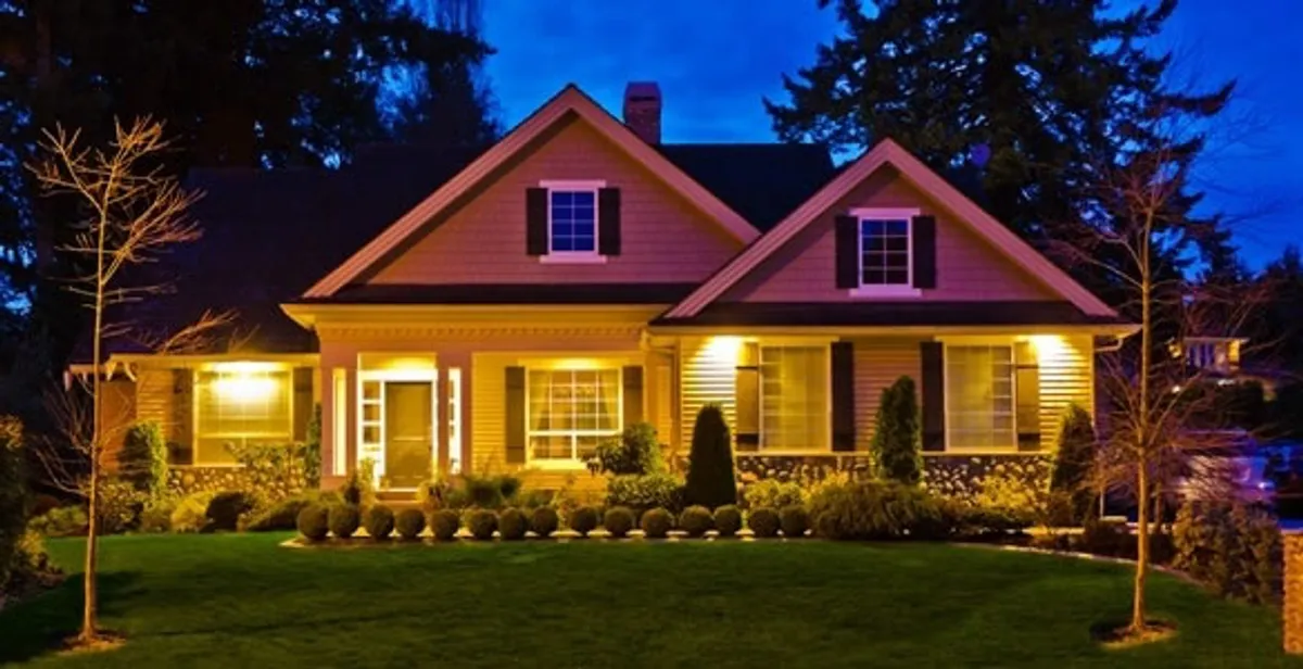 security light installation services illuminating a residential exterior at night in West Palm Beach, FL